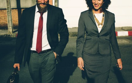 A man and a women in business attire walking