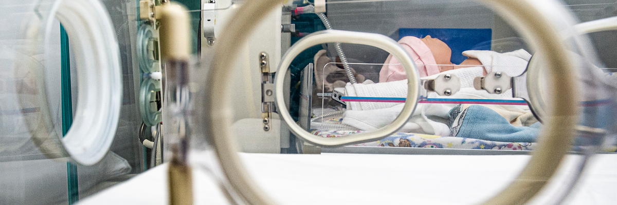 a dummy of a newborn baby in an incubator