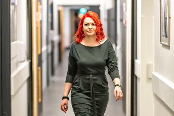 An image of our postgraduate alumni Hazel walking through a corridor for the: receiving an offer and your next steps guide link. 