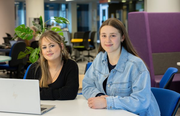 two student sitting in the library 