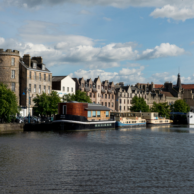 Boats along a river flowing through a town