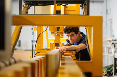 Victor Henquel working with the wood bending machine