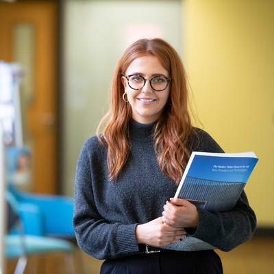 Architectural Technology student, Sophie Orr, holding a textbook