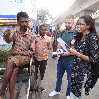 Colin Cochrane with a rickshaw driver in India