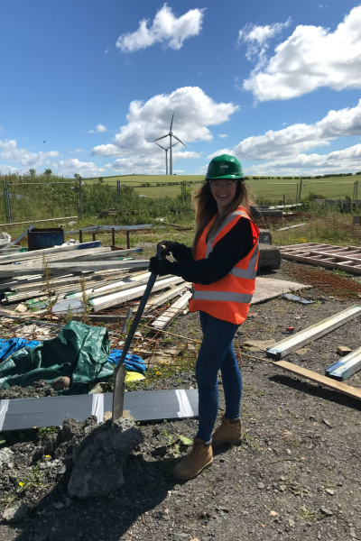 Mechanical Engineering student Emily Rankin with a hard hat and high vis