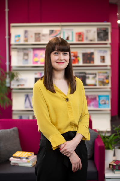 Publishing student, Keara Donnachie, in front of a bookcase