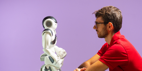 Student in front of a robot