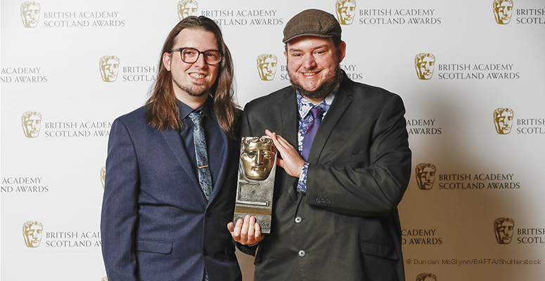 Tom Methven receiving BAFTA Scotland award