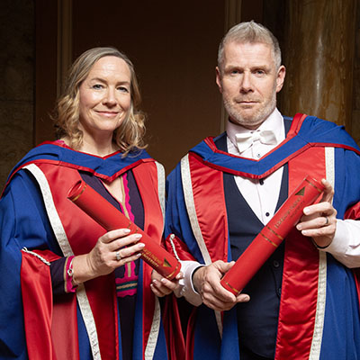 Arlene Stuart and Andrew Bouglas with their honorary degrees.