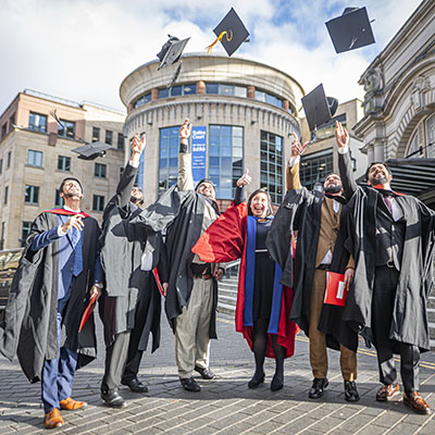 Students celebrating outside Usher Hall following graduation