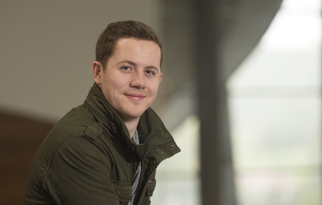 Photo of Business Management student smiling to the camera