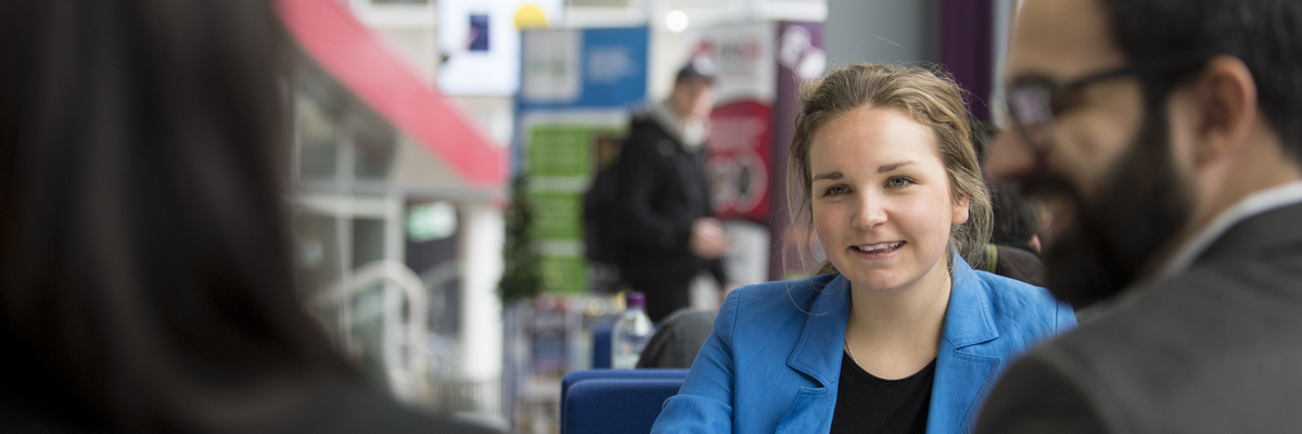 Edinburgh Napier University Students talking together.