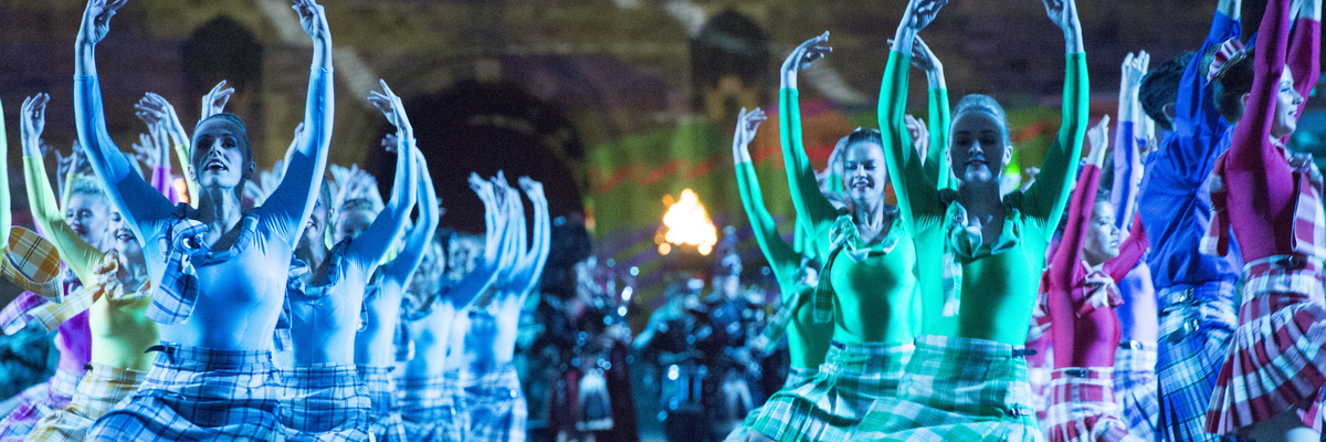 Traditional dancers performing in front of Edinburgh Castle at the Edinburgh Military Tattoo
