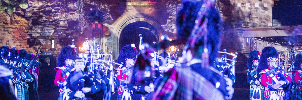 Pipe band performing in front of Edinburgh Castle at the Edinburgh Military Tattoo
