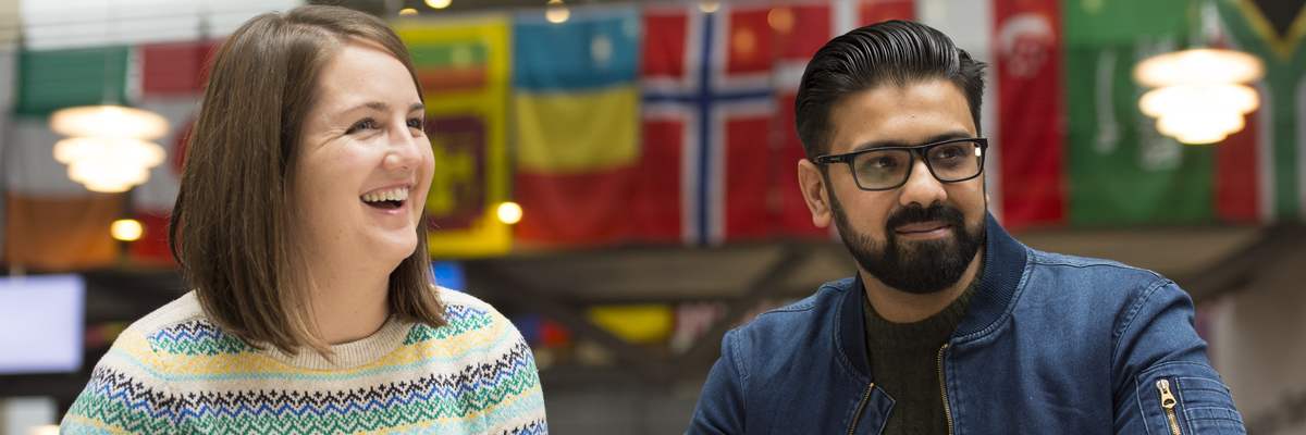 International Student Ambassadors laughing at something to the right of the camera