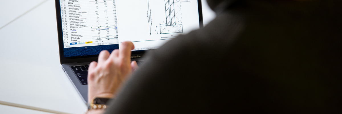 Close up of Quantity Surveying Student working on a laptop