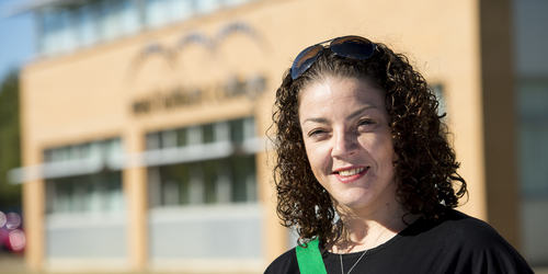Edinburgh Napier University Student outside West Lothian College smiling for the camera