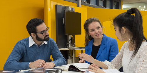 Group of International Student Ambassadors chatting at a table whilst they study