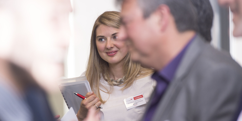 Photo of Edinburgh Napier University student mixing with business contacts at industry event