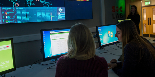 Two female students working in the SOC Lab 