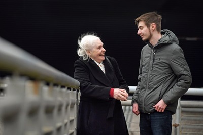 Teresa Morris and student standing talking at bridge