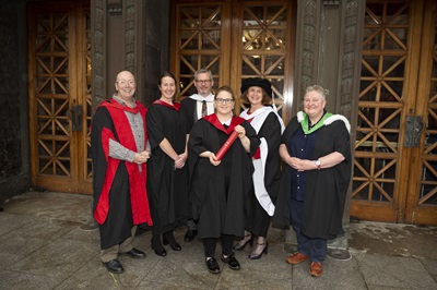 Ann Cumming Prize for Dementia Care winner, Leeann Muir, on graduation day, with ENU staff, all wearing graduation robes