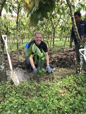George Graham planting a tree in Sulawesi, Indonesia 