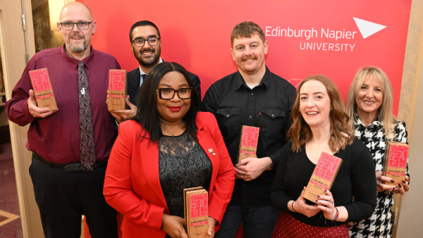2025 winners standing holding their trophies