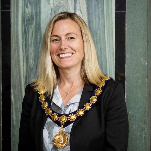 Sheila Lauchlan wearing a medal around her neck