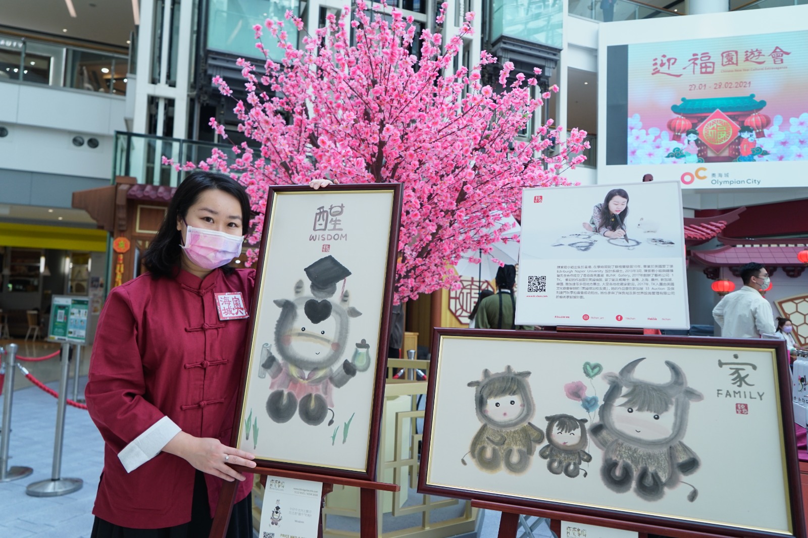TK Chan standing in front of her artwork 