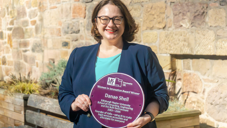 Danae Shell holding her Innovate UK purple plaque