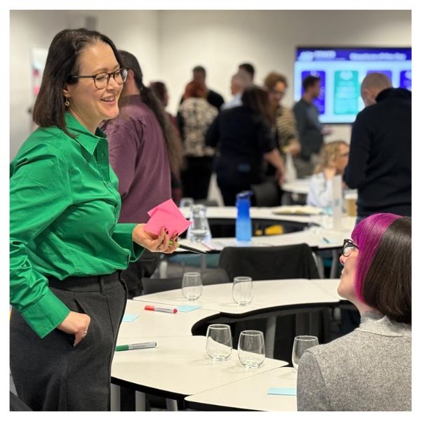Liz Aston speaking to an attendee at at SPACE event