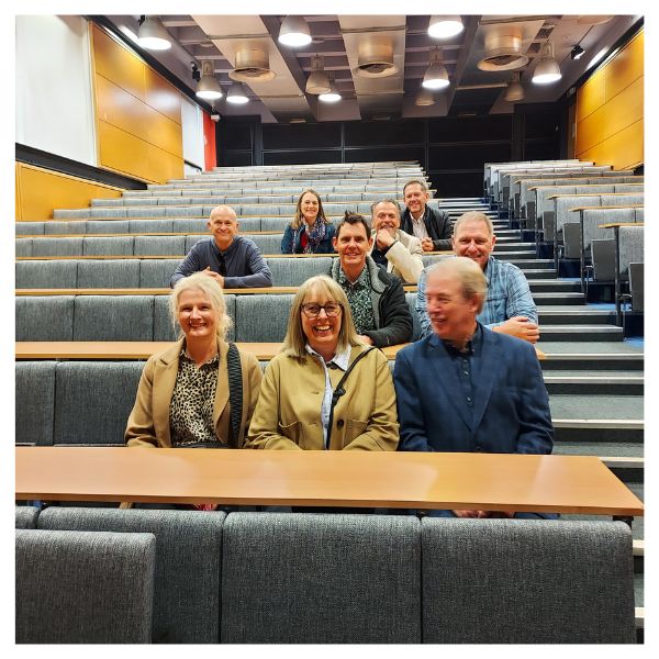 Civil and transport engineering reunion group visiting siting in a lecture theatre