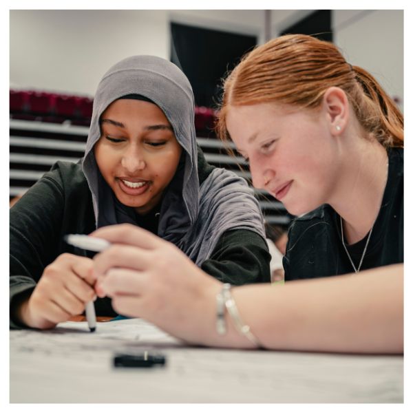 Two students attending a Powering Futures sessions