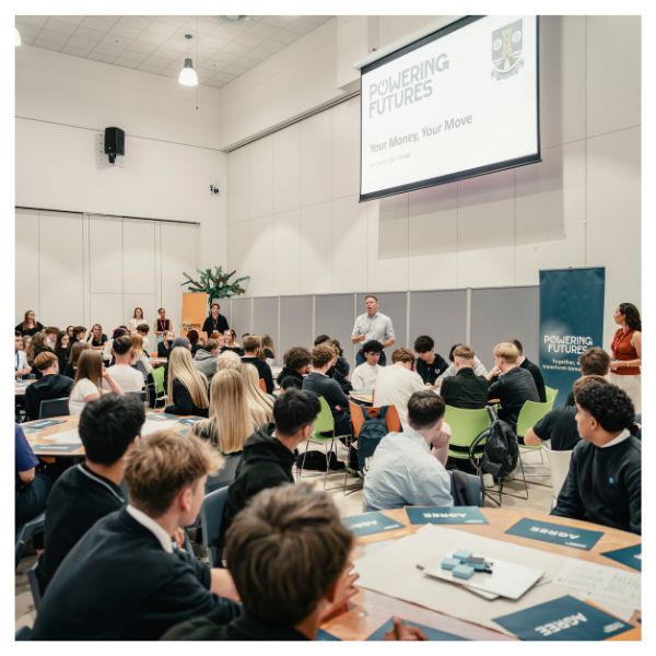 A large group of school students watching a Powering Futures talk