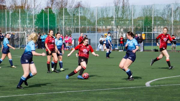 Women's student football team playing a match