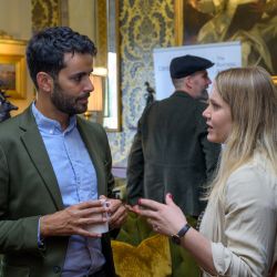 Two people talking at a networking event