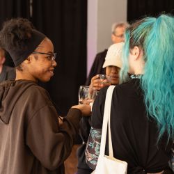 group of people talking at an event