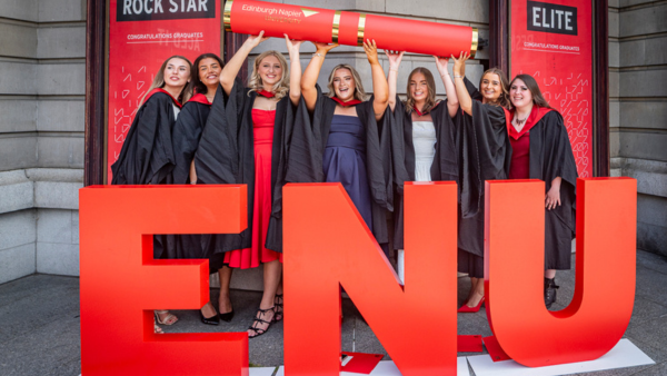 Graduates posing outside Usher Hall