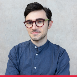 Portrait of Andre Agius, red strip at the bottom 