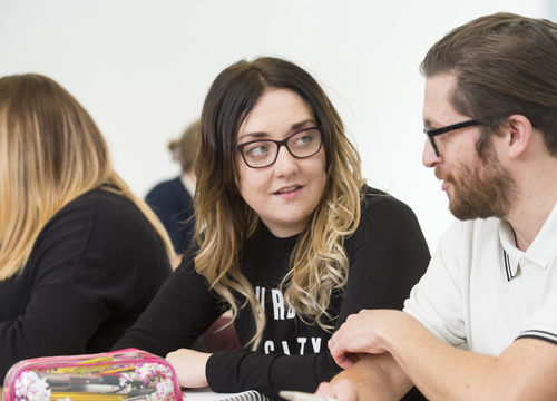 Image of GA students having a conversation