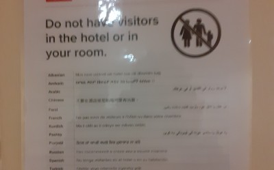Hotel interior sign warning not to have visitors in room 