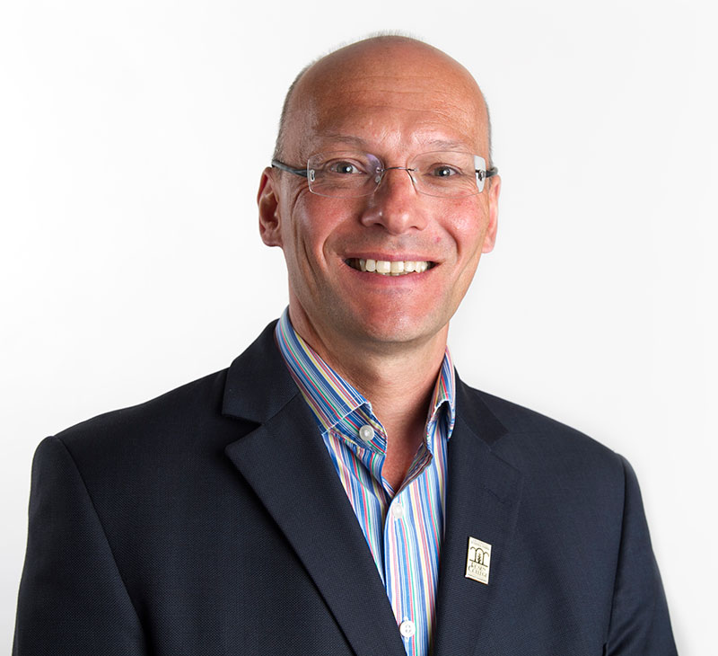 headshot of Alan Fyall