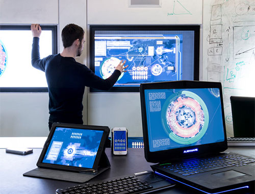 Student working on a big screen in a future meeting room