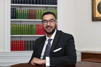 Bilaal Shabbir sitting at a desk