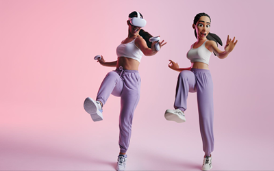 A screenshot of the Carousel game, featuring a human and her AI avatar dancing with VR headsets