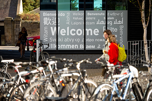 Students walking by bicycles at Merchiston campus