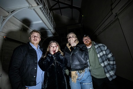 Four people pictured during a visit to Peterhead Prison Museum