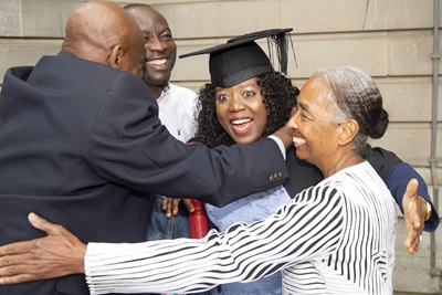 Yemesi Augustina Odebunmi being hugged by her family at graduation