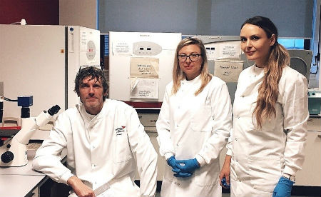 Mick Rae and two colleagues in the laboratory